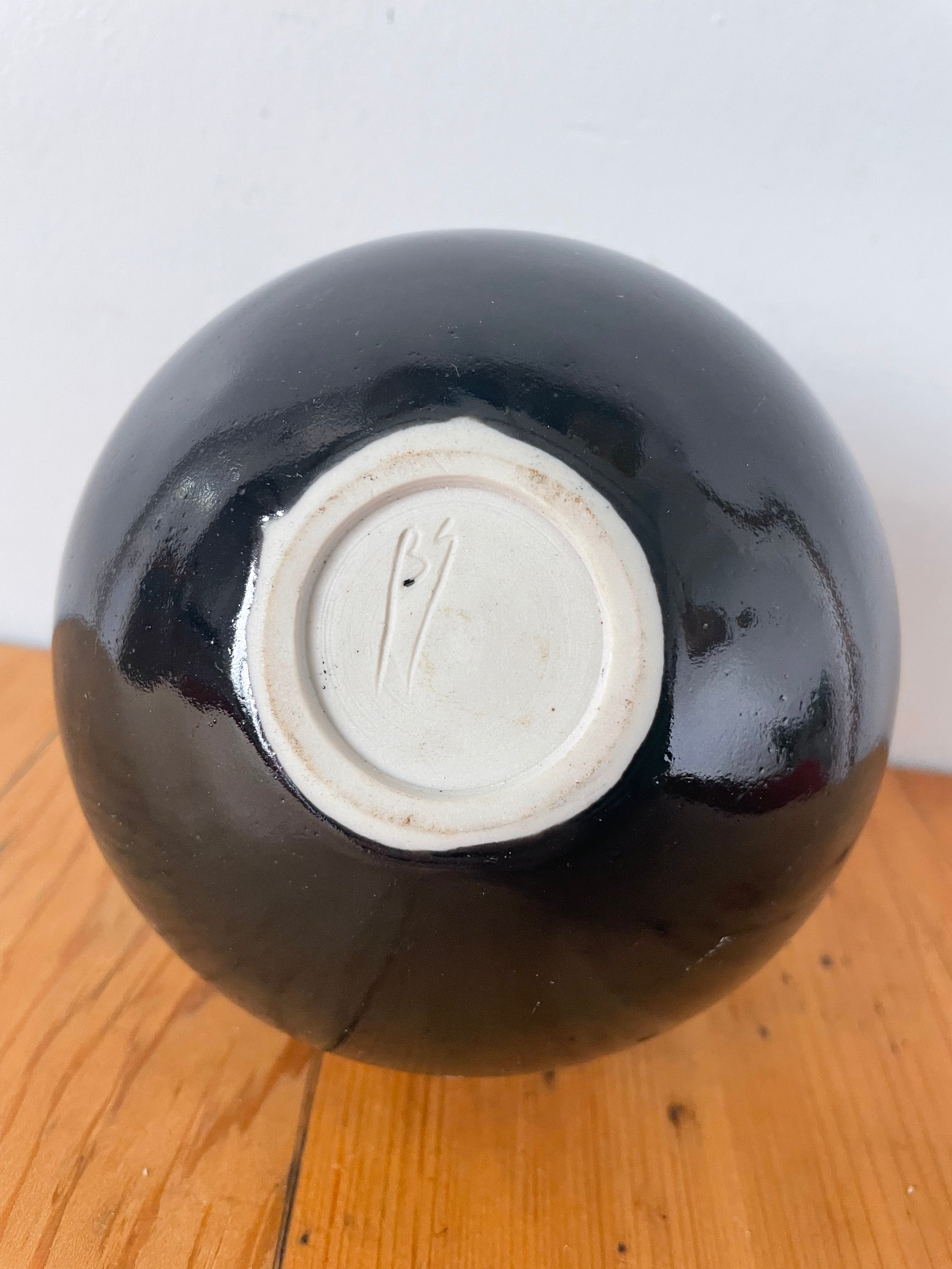 Black And Silver Pottery Vessel