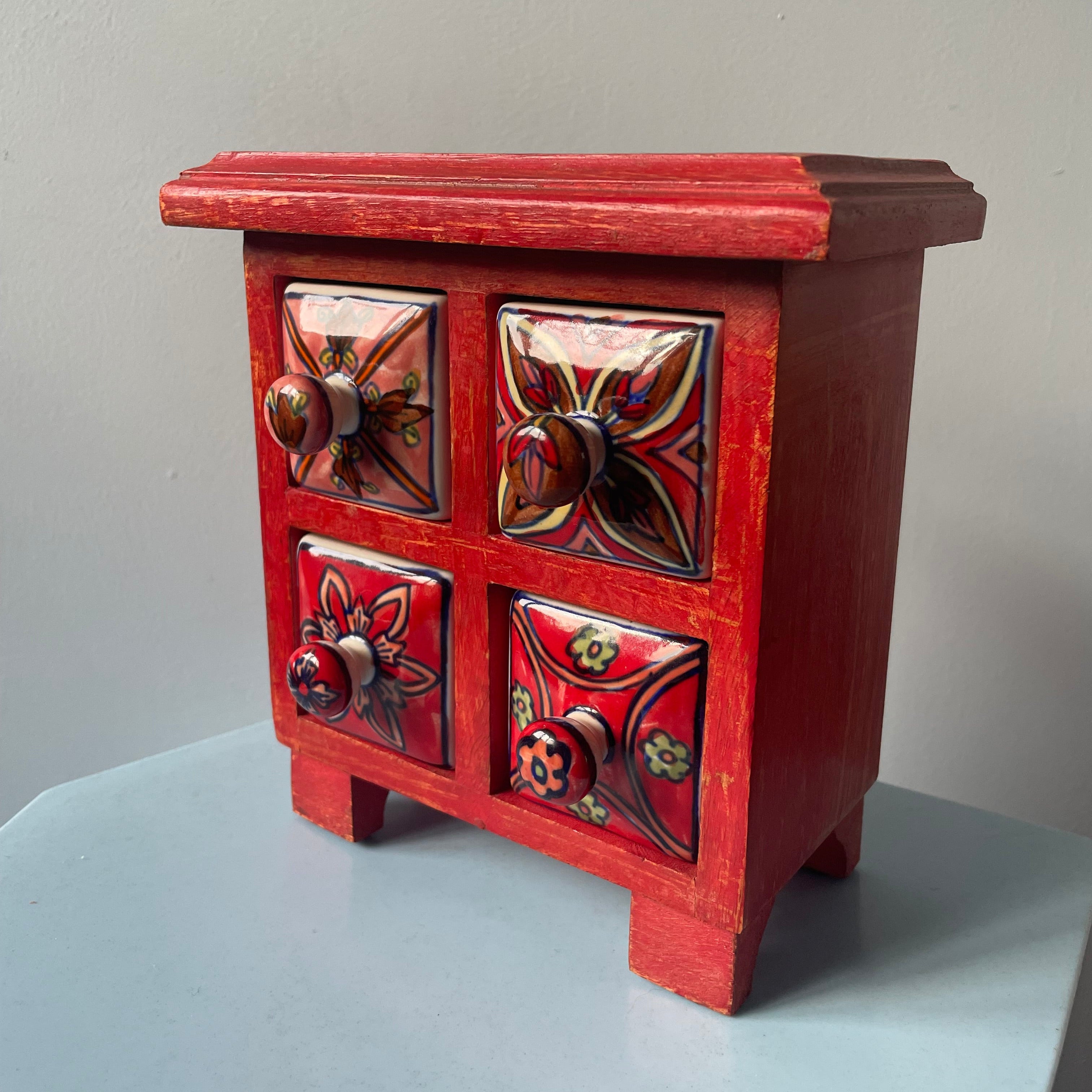 Red Mini Dresser With Porcelain Drawers