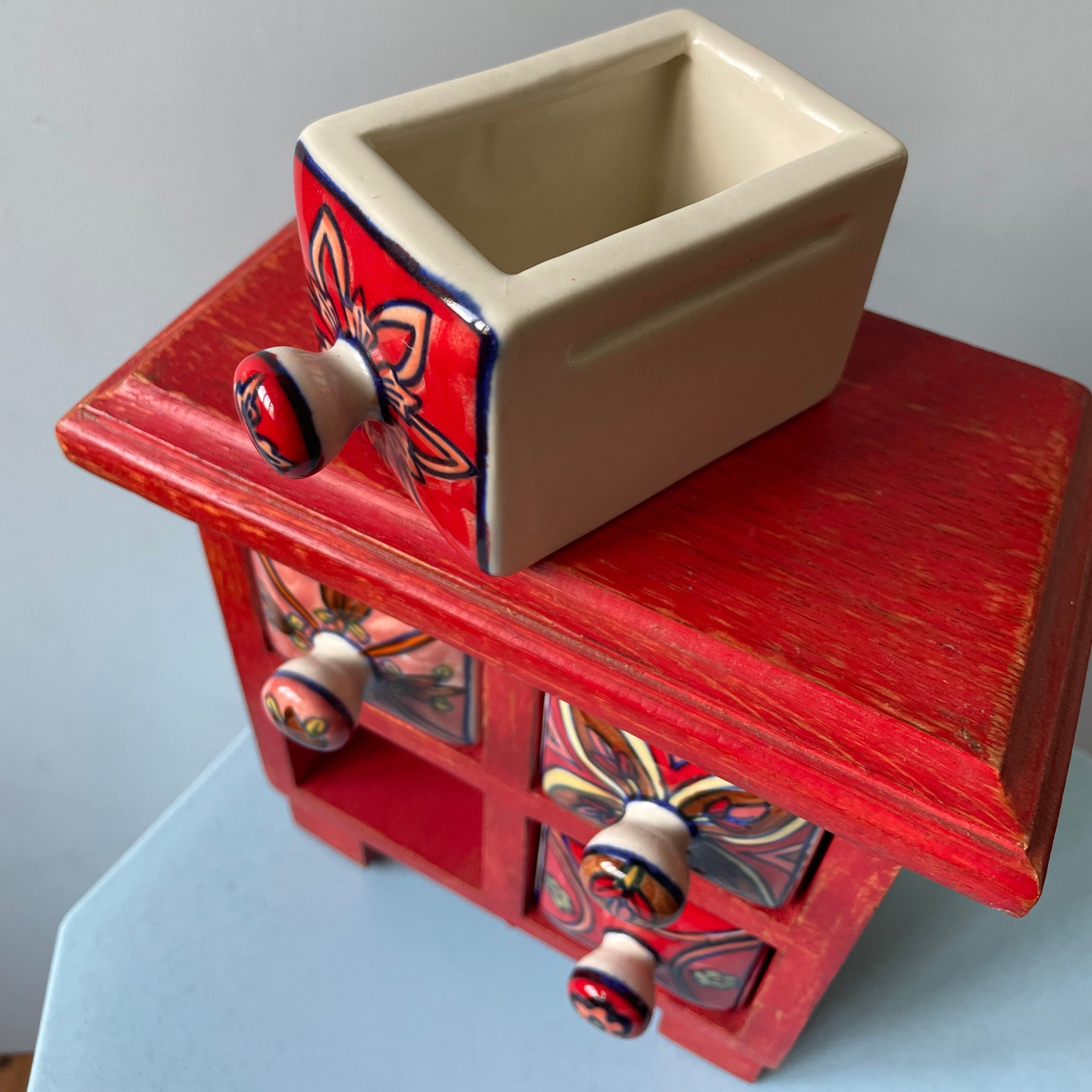 Red Mini Dresser With Porcelain Drawers